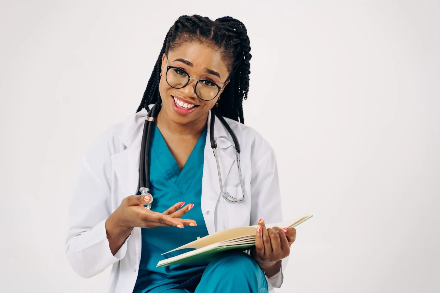 Smiling female GP holding documents in clinic