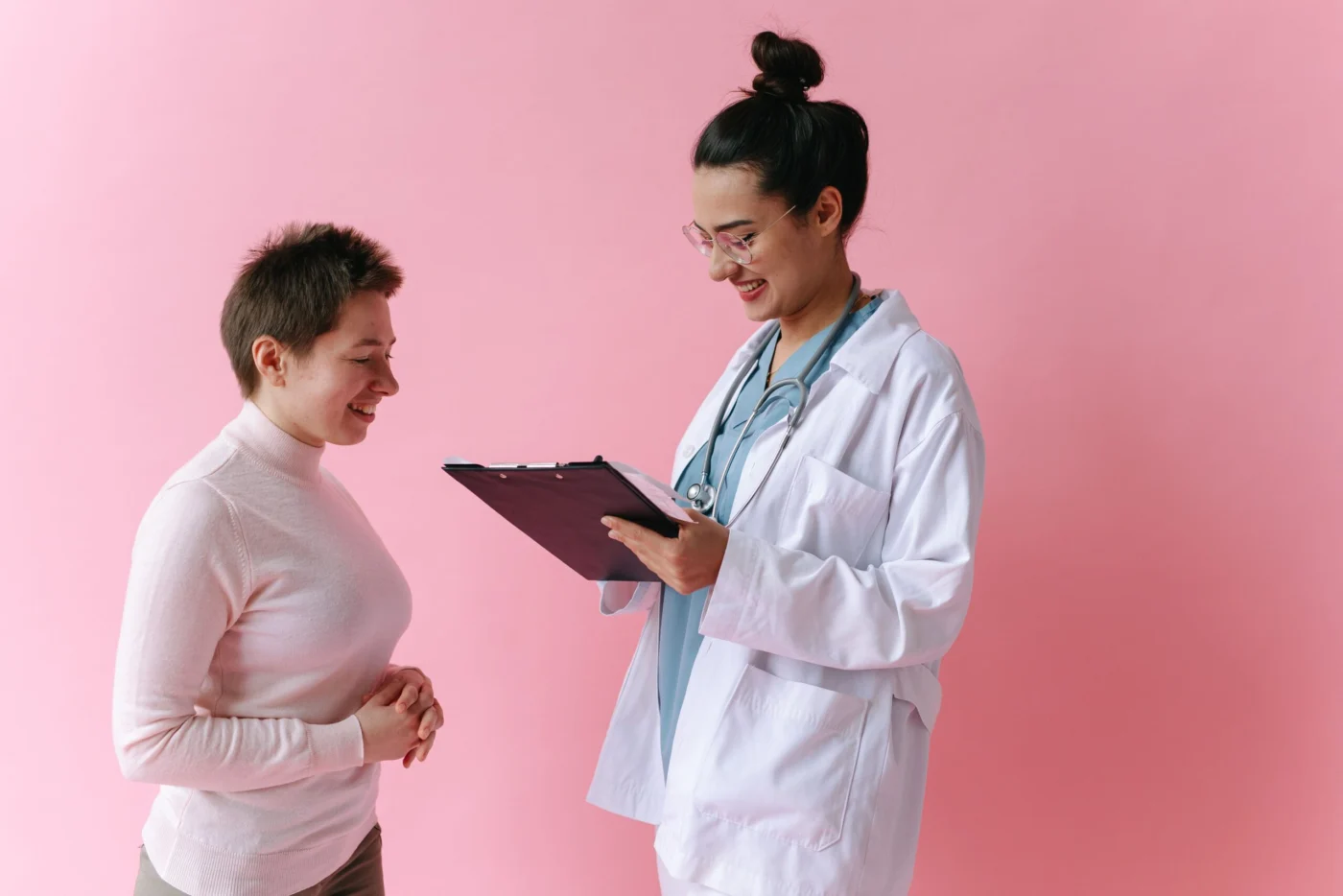 Doctor consulting with a smiling patient during an appointment