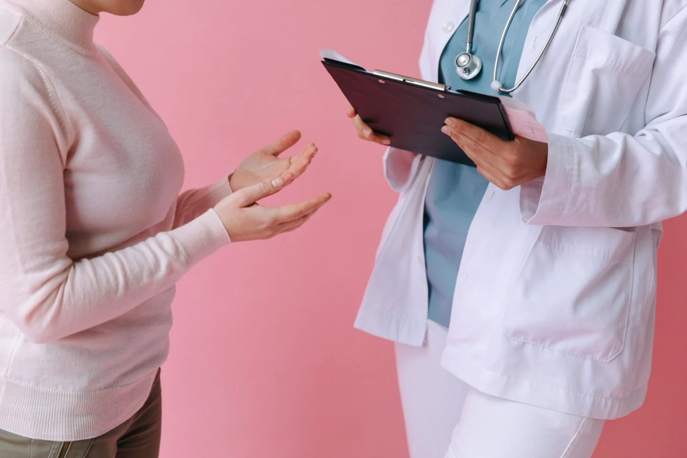 Female doctor discussing a health matter with a patient during a clinical consultation